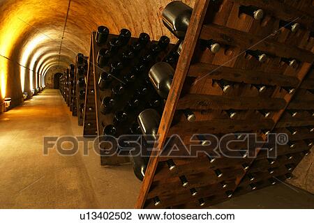 Stock Image - bottles, wine, wine bottles, rows, shelves, array. Fotosearch