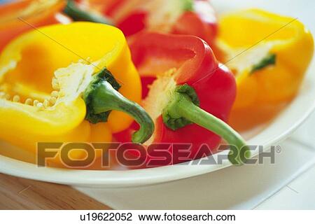 Stock Image - Halves of paprika on plate, Differential Focus, Close Up. Fotosearch