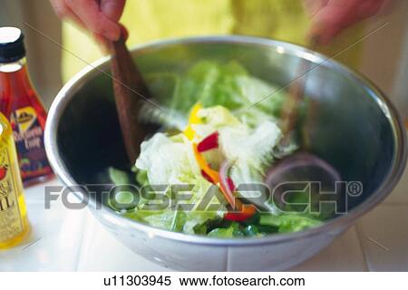 Kitchen worker mixing mixed salad, Blurred Motion View Large Photo Image Stock Photography - Kitchen worker mixing mixed salad, Blurred Motion. Fotosearch