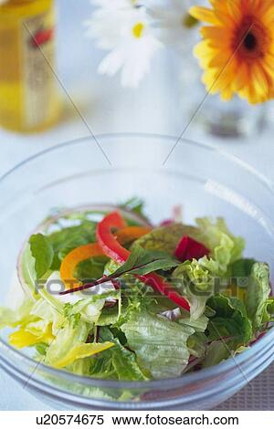 Mixed salad leaves in bowl, flowers and salad dressing bottle visible in background, Differential Focus View Large Photo Image Stock Photography - Mixed salad leaves in bowl, flowers and salad dressing bottle visible in background, Differential Focus. Fotosearch