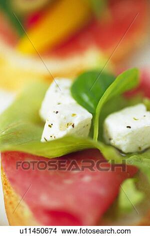 Picture - Mixed salad leaves with cheeses, close up, Differential Focus. Fotosearch