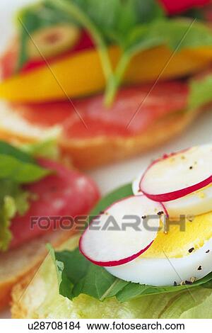 Picture - Mixed salad on baguette, Differential Focus, close up. Fotosearch