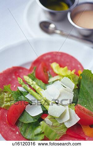 Mixed salad on slices salami, salad dressings visible in background, Differential Focus View Large Photo Image Stock Photograph - Mixed salad on slices salami, salad dressings visible in background, Differential Focus. Fotosearch