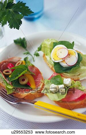 Mixed salad with fork on baguette, glass visible in background, Differential Focus View Large Photo Image Stock Image - Mixed salad with fork on baguette, glass visible in background, Differential Focus. Fotosearch