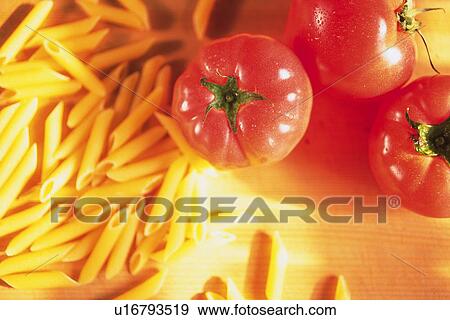 Tomatoes and uncooked pasta, Differential Focus View Large Photo Image Stock Photo - Tomatoes and uncooked pasta, Differential Focus. Fotosearch