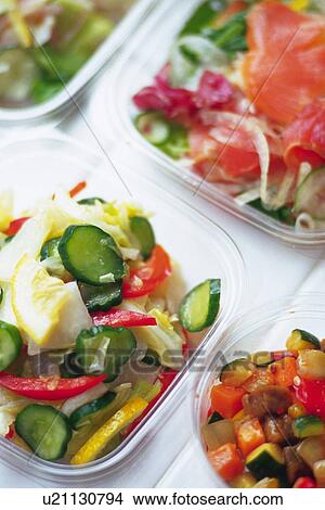 Picture - Various salad in plastic cases, Differential Focus. Fotosearch