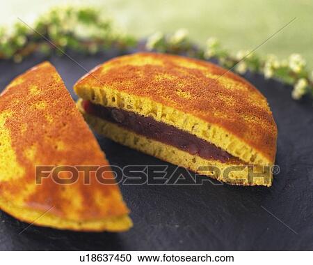Stock Image - Halves Dorayaki on plate, high angle view, Differential Focus. Fotosearch
