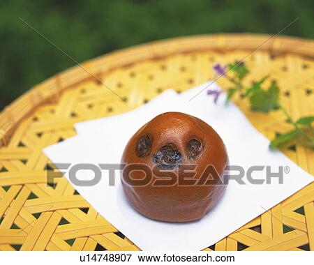 Stock Photo - shi called Cha manjyu on bamboo bowl, high angle view, Differential Focus. Fotosearch