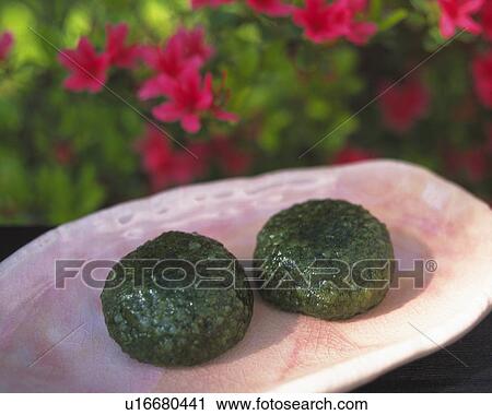 shi called Yomogimochi, Japanese sweets on plate, flower visible in background, Differential Focus View Large Photo Image Stock Image - shi called Yomogimochi, Japanese sweets on plate, flower visible in background, Differential Focus. Fotosearch