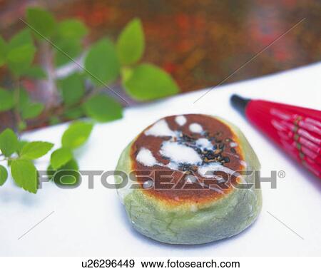 Stock Photo - shi, Japanese sweet, small umbrella beside, high angle view, Differential Focus. Fotosearch