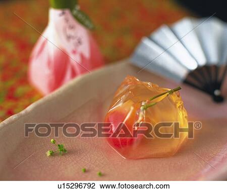 Stock Image - shi, Japanese sweet with fan on plate, high angle view, Differential Focus. Fotosearch