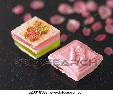 Stock Photo - shi, Japanese sweets and petals in background, high angle view, Differential Focus. Fotosearch