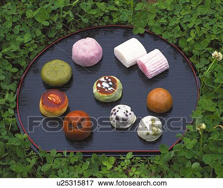 Stock Photo - shi, Various Japanese sweets on plate in bush, high angle view. Fotosearch
