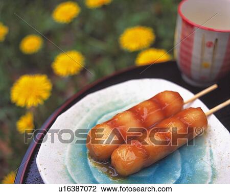 Sweet rice dumplings on plate, sake and flower visible in background, Differential Focus, Close Up View Large Photo Image Stock Image - Sweet rice dumplings on plate, sake and flower visible in background, Differential Focus, Close Up. Fotosearch