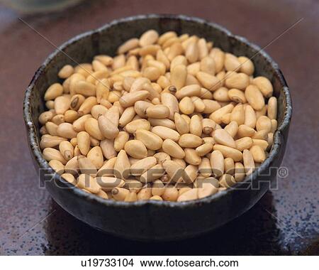 Picture - Closed Up Image of a Little Porcelain Bowl Filled With Stone Pines, High Angle View. Fotosearch