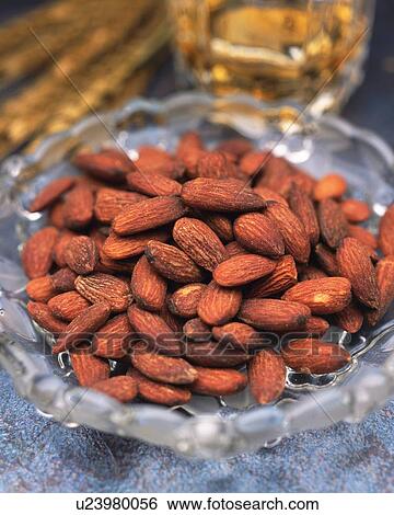 Closed Up Image of a Plate Filled With Almonds and a Glass of Beer Next to It, High Angle View, Differential Focus View Large Photo Image Stock Photograph - Closed Up Image of a Plate Filled With Almonds and a Glass of Beer Next to It, High Angle View, Differential Focus. Fotosearch