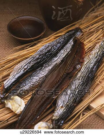 Closed Up Image of a Traditional Japanese Snack, Some Dried Fish and Some Sake, High Angle View View Large Photo Image Picture - Closed Up Image of a Traditional Japanese Snack, Some Dried Fish and Some Sake, High Angle View. Fotosearch