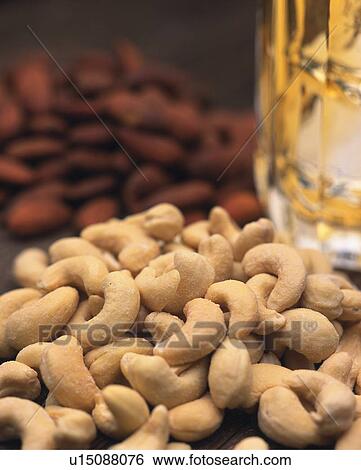 Closed Up Image of Different Kinds of Nuts and a Glass of Beer, Differential Focus View Large Photo Image Stock Photograph - Closed Up Image of Different Kinds of Nuts and a Glass of Beer, Differential Focus. Fotosearch