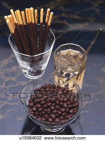Closed Up Image of Several Chocolate Sweets in Glasses, Next to a Drink, High Angle View View Large Photo Image Stock Image - Closed Up Image of Several Chocolate Sweets in Glasses, Next to a Drink, High Angle View. Fotosearch