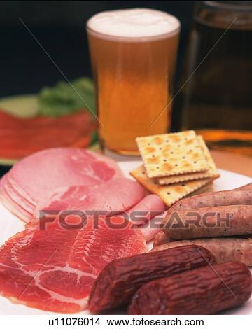 Closed Up Image of Several Different Kinds of Sausages and Hams and a Glass of Beer, Differential Focus View Large Photo Image Picture - Closed Up Image of Several Different Kinds of Sausages and Hams and a Glass of Beer, Differential Focus. Fotosearch