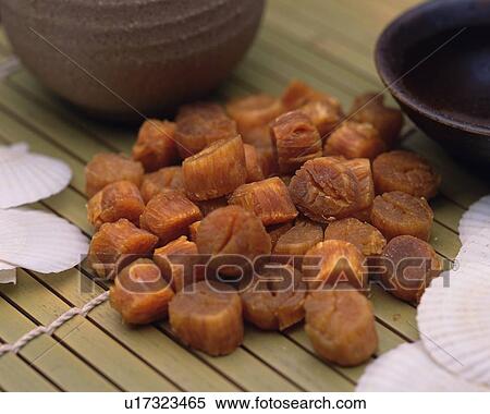 Stock Photography - Closed Up Image of Several Grilled Common Scallop on a Bamboo Surface, High Angle View. Fotosearch