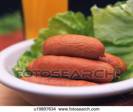 Picture - Closed Up Image of Several Sausages on a Porcelain Plate and Some Beer Next to Them, Differential Focus. Fotosearch