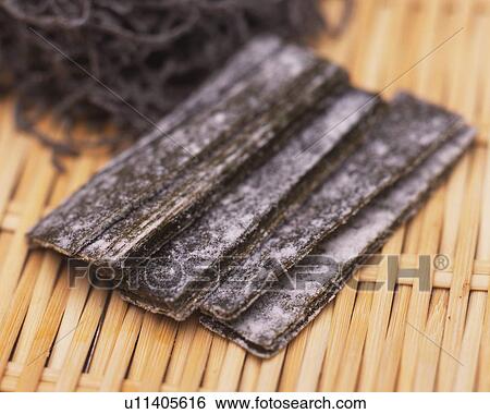 Closed Up Image of Several Slices of Dried Seaweed on a Wooden Surface, High Angle View, Differential Focus View Large Photo Image Stock Photograph - Closed Up Image of Several Slices of Dried Seaweed on a Wooden Surface, High Angle View, Differential Focus. Fotosearch