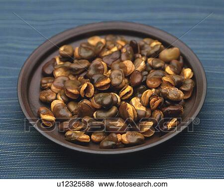 Stock Photo - Closed Up Image of Several Brown-colored Beans on a Little Plate, High Angle View. Fotosearch