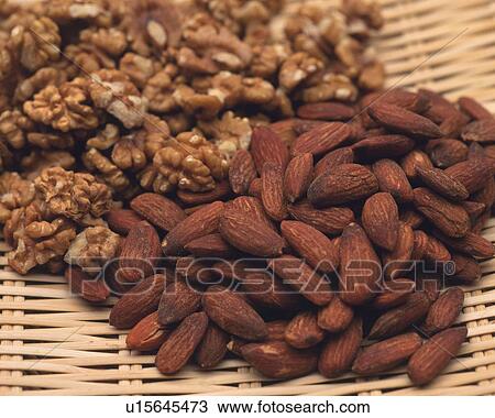 Closed Up Image of Several Walnuts and Almonds on a Wooden Plate, High Angle View View Large Photo Image Stock Image - Closed Up Image of Several Walnuts and Almonds on a Wooden Plate, High Angle View. Fotosearch