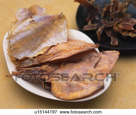 Stock Photo - Closed Up Image of Some Dried Seafood on Some Porcelain Plates, High Angle View. Fotosearch