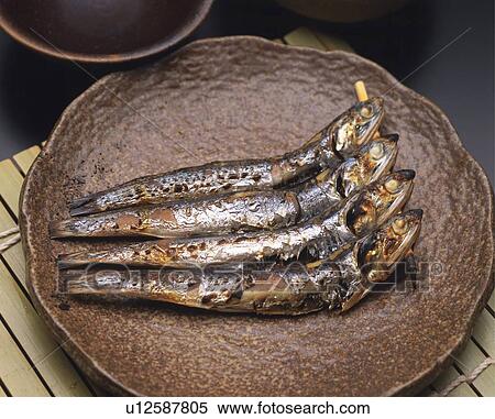 Closed Up Image of Some Grilled Fish on a Brown-colored Porcelain Plate, High Angle View View Large Photo Image Stock Photography - Closed Up Image of Some Grilled Fish on a Brown-colored Porcelain Plate, High Angle View. Fotosearch