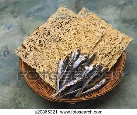 Stock Image - Closed Up Image of Some Traditional Japanese Snacks, Such as Some Dried Fish and Little Fish in a Wooden Bowl, High Angle View. Fotosearch