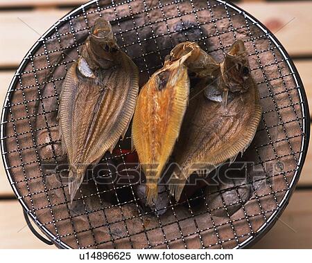 Closed Up Image of Three Fish Being Grilled on a Japanese Grill, High Angle View View Large Photo Image Stock Photography - Closed Up Image of Three Fish Being Grilled on a Japanese Grill, High Angle View. Fotosearch