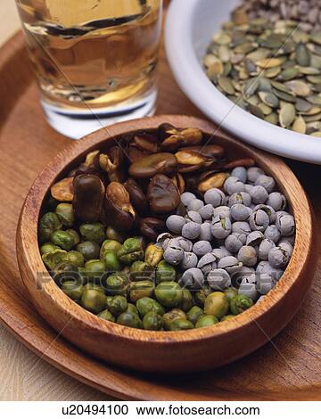 Stock Image - Closed Up Image of Two Bowles Filled With Snacks Such as Seeds and Beans, High Angle View. Fotosearch