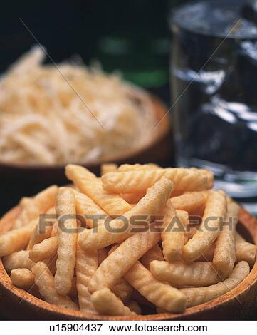 Stock Photo - Closed Up Image of Two Bowles Filled With Traditional Japanese Snacks and a Drink, Differential Focus. Fotosearch