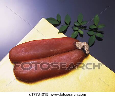 Closed Up Image of Two Pieces of Dried Mullet Roe on a Black and Golden Surface, High Angle View View Large Photo Image Stock Photography - Closed Up Image of Two Pieces of Dried Mullet Roe on a Black and Golden Surface, High Angle View. Fotosearch