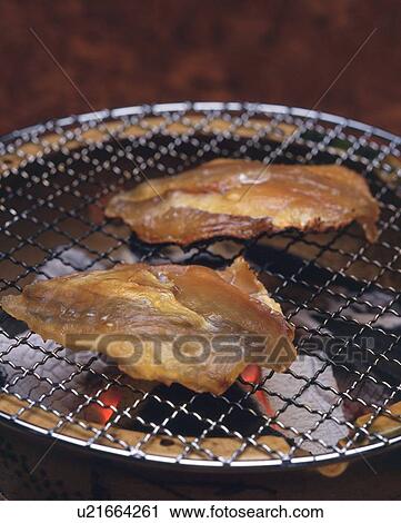 Closed Up Image of Two Pieces of Threadsail Filefish on a Grill, High Angle View View Large Photo Image Stock Image - Closed Up Image of Two Pieces of Threadsail Filefish on a Grill, High Angle View. Fotosearch