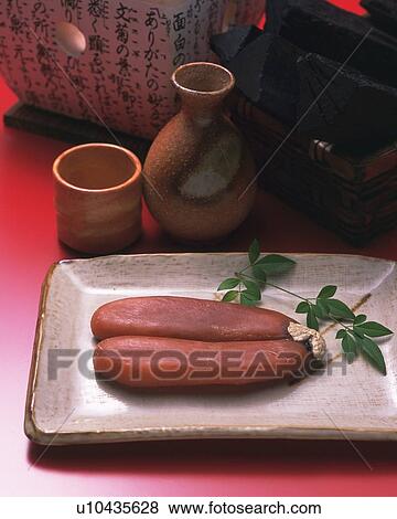 Stock Photo - Image of a Typical Two Dried Mullet Roe With Some Sake, High Angle View. Fotosearch
