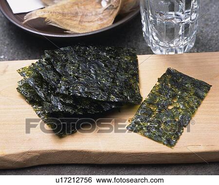 Stock Photograph - Image of Some Dried Seaweed on a Wooden Surface and Some Sake, High Angle View. Fotosearch