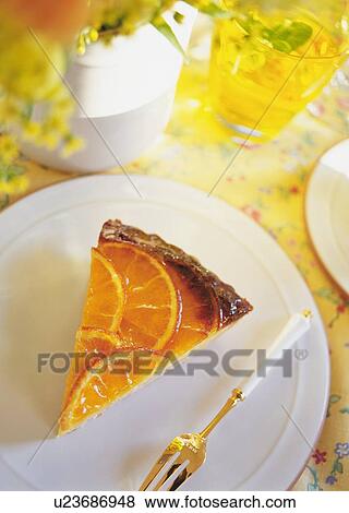 A slice of orange tart on plate View Large Photo Image Stock Photo - A slice of orange tart on plate. Fotosearch