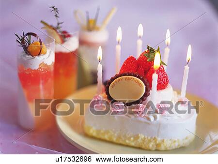 Stock Photograph - Birthday cake and jelly in glasses. Fotosearch