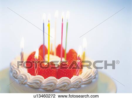 Stock Image - Birthday cake with strawberry and whipped cream. Fotosearch