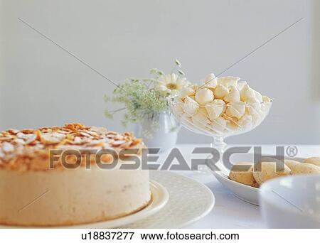 Cake and candies on dining table View Large Photo Image Stock Photo - Cake and candies on dining table. Fotosearch