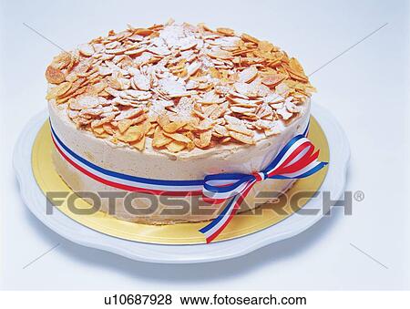 Stock Photo - Cake strewed with almond slices, Wrapped by ribbon. Fotosearch