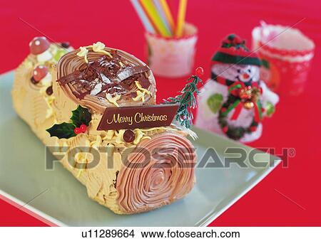 Christmas cake rolled up and covered with chocolate cream, Yolu log View Large Photo Image Picture - Christmas cake rolled up and covered with chocolate cream, Yolu log . Fotosearch