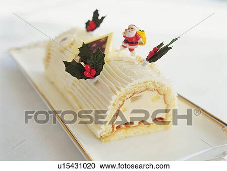Christmas cake rolled up and covered with cream, Yolu log View Large Photo Image Stock Image - Christmas cake rolled up and covered with cream, Yolu log . Fotosearch
