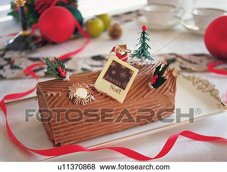 Christmas cake rolled up and covered with chocolate cream, Yolu log View Large Photo Image Stock Photo - Christmas cake rolled up and covered with chocolate cream, Yolu log . Fotosearch