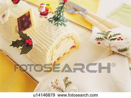Stock Photo - Christmas cake rolled up and covered with cream, Yolu log . Fotosearch