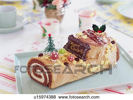 Stock Photo - Christmas cake rolled up and covered with chocolate cream, Yolu log . Fotosearch