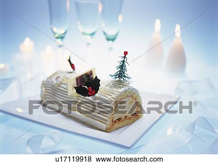 Stock Photo - Christmas cake rolled up and covered with cream, Yolu log . Fotosearch